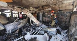 IDF personnel surveying damage at a missile attack site.