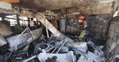 IDF personnel surveying damage at a missile attack site.
