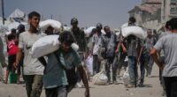 Israeli strikes kill at least 34 people in Gaza, officials say, as some aid restrictions are eased
