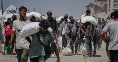 Israeli strikes kill at least 34 people in Gaza, officials say, as some aid restrictions are eased