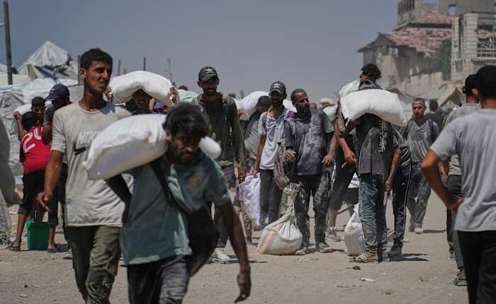 Israeli strikes kill at least 34 people in Gaza, officials say, as some aid restrictions are eased
