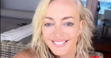 Jackie O Henderson sizzles in plunging red  swimsuit
