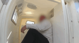 A 59-year-old man in police custody after being arrested for allegedly assaulting a crew member before a flight from Perth to Brisbane took off.