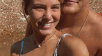 A young woman and man smiling for a selfie.