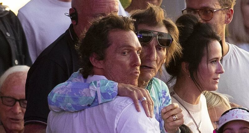 Matthew McConaughey shares a hug with Ronnie Wood at BST Hyde Park