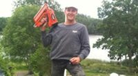 Photo of Glen Godfrey holding a nail gun.