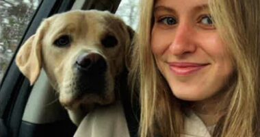 Eliotte Heinz and her dog in a car.