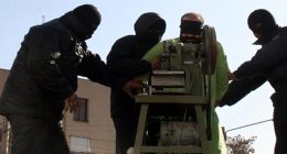 A blindfolded man's fingers being amputated by a circular saw.