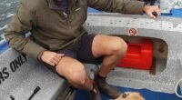 Surfer Steven Payne (pictured, with his dog Poppy) had been travelling Western Australia with his partner Catherine Birch when he was fatally attacked by a great white, an inquest has heard