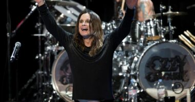 Ozzy Osbourne performing on stage.