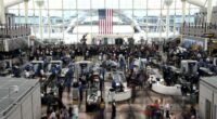 Passengers flee smoking jet on emergency slide after apparent landing gear problem at Denver airport