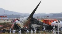 Rescue team members work at the site of a plane crash at Muan International Airport in Muan, South Korea on Dec. 31, 2024. 181 people were killed in the crash.