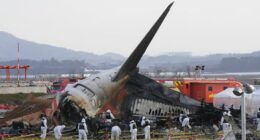 Rescue team members work at the site of a plane crash at Muan International Airport in Muan, South Korea on Dec. 31, 2024. 181 people were killed in the crash.