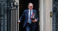 Keir Starmer leaving 10 Downing Street carrying files.