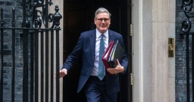 Keir Starmer leaving 10 Downing Street carrying files.
