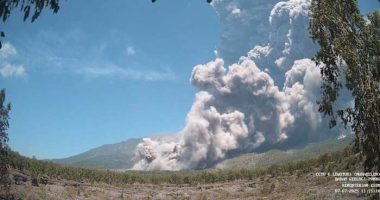 Residents wear masks as volcanic ash blankets villages near erupting Indonesian volcano