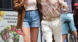 Rocker Rod Stewart and his wife Penny Lancaster looked madly in love as they cosied up during a stroll in New York City