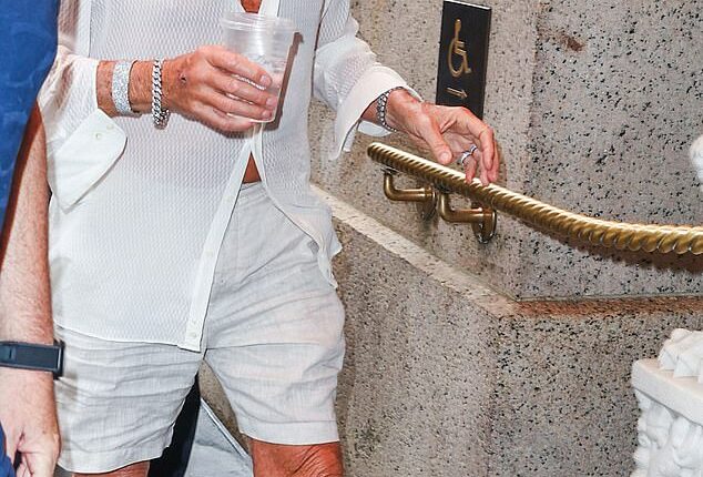 Rod Stewart cut a dapper figure as he stepped out in New York on Friday flashing a glimpse of his bronzed chest in a loose fitting open-necked white shirt, which he paired with linen shorts