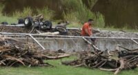 A man surveys debris and flood damage along the Guadalupe River, Sunday, July 13, 2025, in Kerrville, Texas. (AP Photo/Eric Gay)