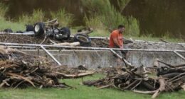 A man surveys debris and flood damage along the Guadalupe River, Sunday, July 13, 2025, in Kerrville, Texas. (AP Photo/Eric Gay)