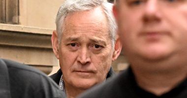 Close-up of Ian Wilkinson outside a court building.