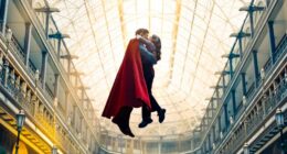 Superman and Lois Lane kissing while flying.