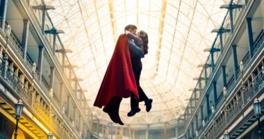 Superman and Lois Lane kissing while flying.