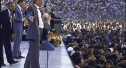Jimmy Swaggart preaching to a large crowd.