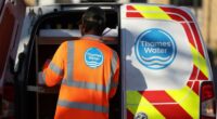 Man at back of van with Thames Water logo