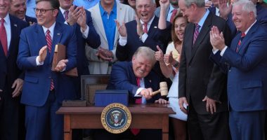 Trump signs his tax and spending cut bill at the White House July 4 picnic