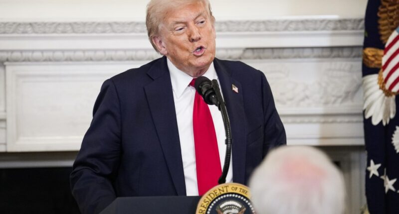 President Trump speaking at a podium.