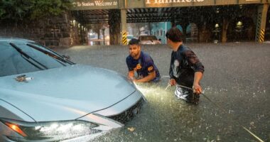 Two die trying to escape New Jersey floods that turned roads to rivers