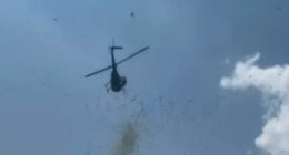 Helicopter dropping cash from the sky.