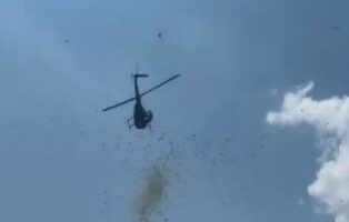 Helicopter dropping cash from the sky.