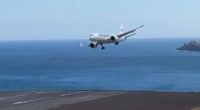 Plane landing in strong winds at Madeira Airport.