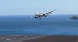 Plane landing in strong winds at Madeira Airport.