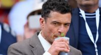 Weary-eyed Orlando Bloom attends Wimbledon - after boozy Oasis gig