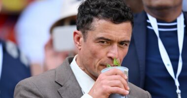 Weary-eyed Orlando Bloom attends Wimbledon - after boozy Oasis gig