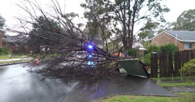 Wild weather knocks out power, cuts trains and threatens homes