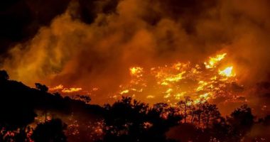 More than 200 firefighters are struggling to tackle an out-of-control wildfire on Crete â€” Greece's largest island and a tourist hotspot â€” as authorities order mass evacuations.