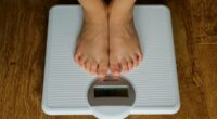 Woman warned her husband is cheating over sign on bathroom scales