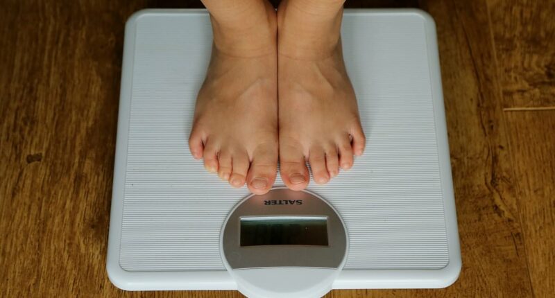 Woman warned her husband is cheating over sign on bathroom scales