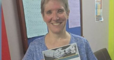 The woman who lost an arm in a lion attack at a Queensland zoo has been identified as New South Wales teacher Jo Cabann.