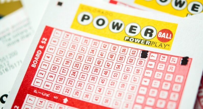 Close-up of Powerball lottery tickets with Quick Pick selections.
