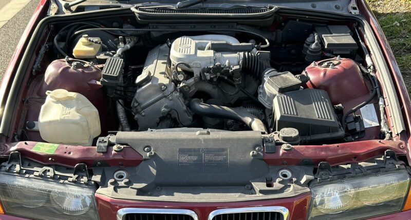 BMW pulled over without bonnet, driver's seat in Melbourne
