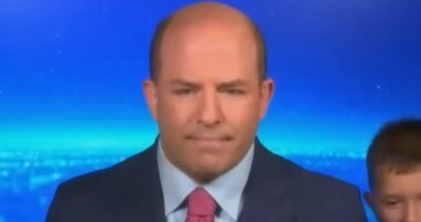 Hilarious moment CNN media analyst's five-year-old son gatecrashes dad's live TV interview