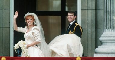 Around 100,000 people turned out to watch the happy couple kiss and wave from the balcony