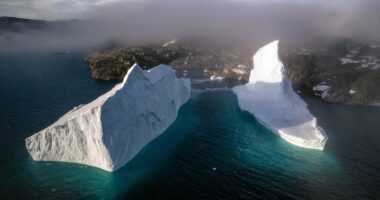 Huge iceberg drifting dangerously close to shore in Greenland