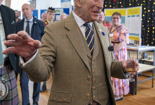 The King (pictured) has been spotted knocking back a glass of whisky in Scotland on Thursday, during a visit to Campbeltown