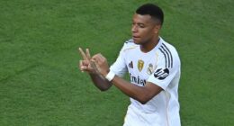 Kylian Mbappe dedicates stunning scissor-kick to Diogo Jota as Real Madrid survive late scare to beat Borussia Dortmund in thriller after THREE goals in added time- and set up crunch semi-final clash with PSG